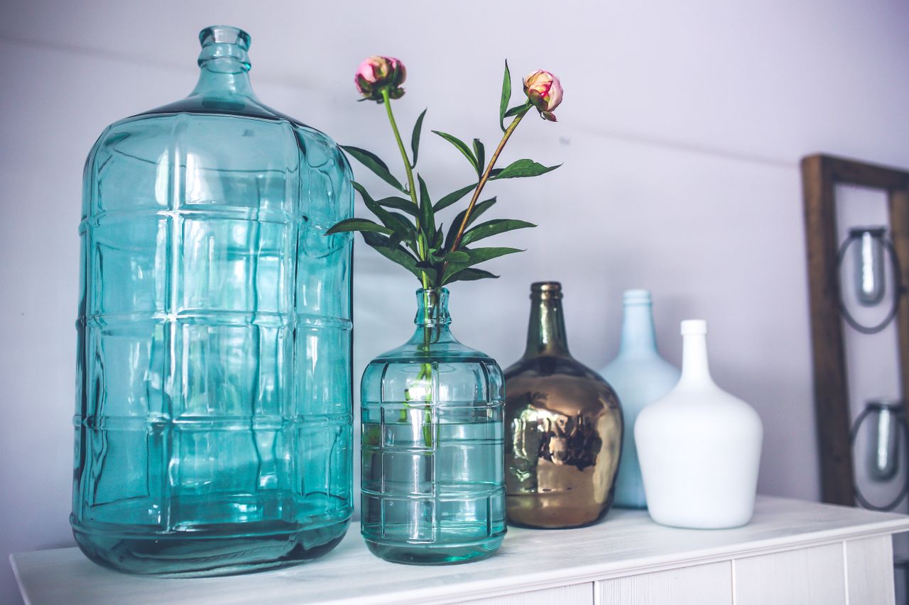 Home Decorative glass vases and peonies create an elegant home decor ambiance.