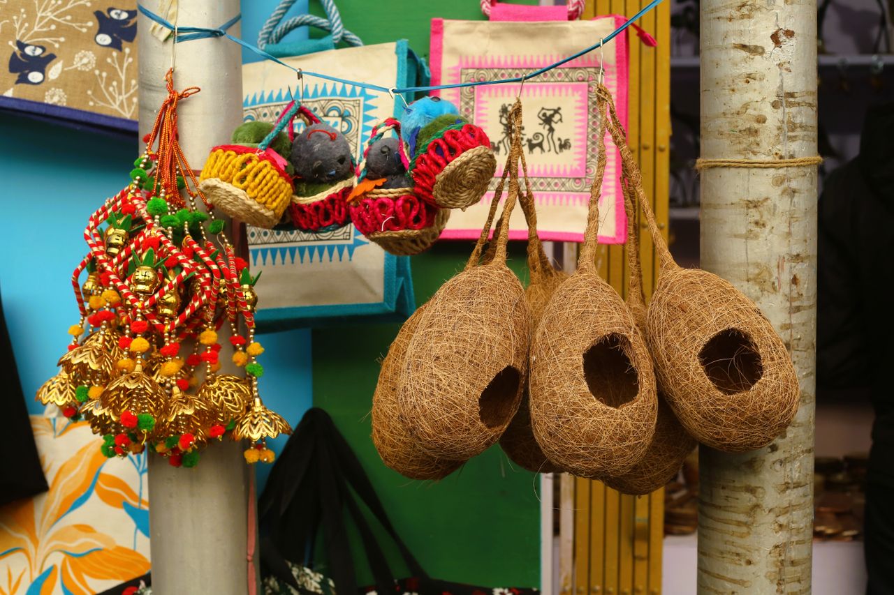 Home Colorful assortment of handcrafted items at an artisan market.