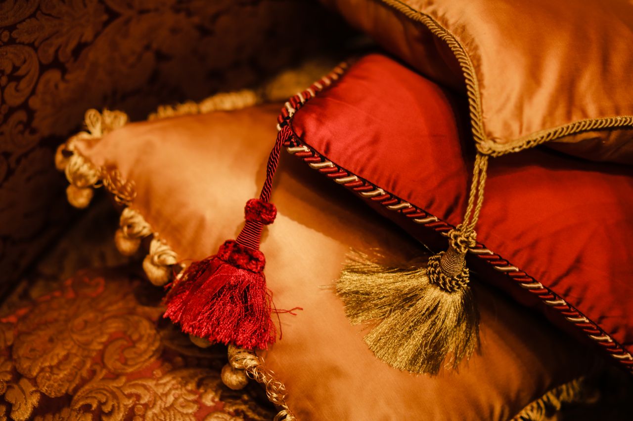 about-img-01 Elegant velvet cushions with decorative tassels add a touch of luxury to any interior space.